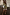 Thumbnail for Olive and pink lace shorts in green satin with contrast lace trim, styled with a matching shirt and patterned clutch.