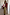 Thumbnail for Olive Mystical Dorris Skirt in green with celestial motifs, styled with a colour-block cardigan and leopard clutch.