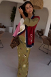 Mystical Martha Cardigan in a multicoloured knit with embroidered motifs, styled with a printed olive maxi skirt.