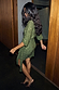 Olive Sequin Mini Vienna Petite wrap dress with shimmering green sequins and long sleeves, styled with leopard print heels.