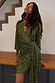Olive Sequin Mini Vienna Petite dress with green sequins, a wrap front, and multi-wear tie waist, shown on a model.