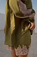 Olive green satin shorts featuring a contrast pink lace hem, styled with the matching lace-trimmed shirt.