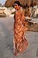 Peach Paisley Ava Dress featuring a draped cowl back and all-over paisley print, ideal for a vacation look.