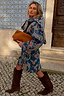 Longline Denim Paisley Belted Shacket in blue with a pink and green print, paired with brown boots on a tiled street.