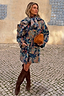 Thumbnail for Blue Denim Paisley Belted Shacket with a vibrant print and waist belt, styled with brown suede boots.