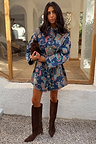 Denim Paisley Belted Shacket in blue with a bold print, cinched at the waist and paired with suede boots.