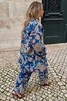 Blue Denim Paisley Belted Shacket and matching trousers with leopard heels on a London cobbled street.
