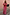 Thumbnail for Pink Paisley Dorris Skirt and matching knit cardigan with red trim, worn by a model on a cobblestone street.