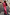 Thumbnail for Pink Paisley Dorris Skirt and matching cardigan worn with leopard print heels on a cobblestone street.