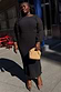 Black Plisse Perrie Dress featuring sheer sleeves and elasticated cuffs, worn by a curve model for inclusive fashion.