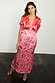 Pink and Red May Dress with sun motifs, featuring pleated cups and puff sleeves in a body-sculpting midi fit.