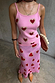 Pink Hearts Knit Tank featuring a red heart print on a pink base, styled as a co-ord with a matching skirt.