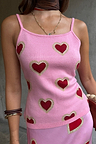 Pink Hearts Knit Tank featuring a bold red heart print and thin straps in a soft, bright pink knit.