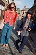 Navy Pinstripe Arden Trousers and matching blazer styled with a graphic tee for a London street style look.
