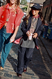 Navy Pinstripe Arden Trousers and matching blazer styled for London looks on a cobbled street.