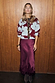 Thumbnail for Burgundy and blue poppy print knit cardigan with leopard trim, styled with a long satin skirt.
