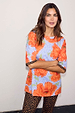 NFD Blue Poppy Print Jersey Pyjamas with orange poppies and leopard print trousers on a model.