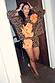 Poppy Leopard Shorts and sweatshirt with orange poppy motifs and leopard print on a size 10 model.