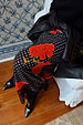 Black Poppy Midi Maeva Skirt in an iconic poppy and polka dot print with black lace trim, styled with boots.