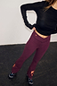 Thumbnail for Burgundy cotton flare pants with coral embroidered motifs, designed in London for an effortless gym look.