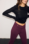 Burgundy Cotton Wide Leg Pants with coral star embroidery and a V-shaped waistband, styled with a black top.