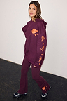 Burgundy hoodie with coral embroidery and matching flare leggings featuring iconic bird and sun motifs.