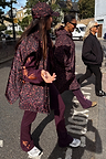 Burgundy cotton wide leg pants with coral embroidery, styled with a leopard print gilet for a London look.