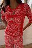 Thumbnail for Red Bandana Rib Jersey Top featuring a white paisley print, styled with layered gold necklaces.
