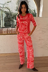 Red Bandana Rib Jersey Top with a white paisley print and 3/4 sleeves, styled as a co-ord with matching trousers.