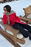 Red Ski Knit Long Cardigan with blue buttons and tie waist, designed in London and styled in a snowy setting.