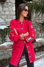 Thumbnail for Red Ski Knit Long Cardigan featuring embroidered motifs and blue buttons, styled in a snowy setting.