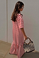 Red Stripe Jersey Dress in cotton with an asymmetric gathered skirt and oversized T-shirt fit, shown on a model.