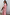 Thumbnail for Red Stripe Jersey Dress with a white collar and asymmetric skirt, styled with tortoiseshell sunglasses.
