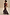 Thumbnail for Cherry Leopard Remi midaxi dress with pleated frills on the neckline and red frill sleeves against stone stairs.