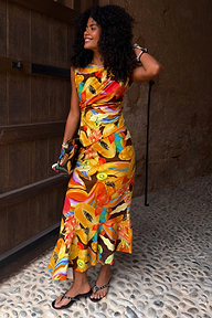 Rio A-Symmetric Top in a fruit print and colour block design, styled with a co-ord skirt and clutch.
