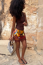 Rio Mini Maeva Skirt featuring a tropical fruit placement print and delicate brown lace trim at the hem.