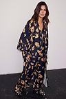 Deloris Satin Robe in black with iconic gold motifs, styled with matching pyjamas and slippers for a full nightwear set.