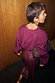 Thumbnail for Burgundy Ruffle Miley Shirt featuring an embroidered logo on the back neck and blouson sleeves in a wine tone.