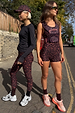 Dark leopard print running vest bag paired with matching activewear on a model for a London street style look.