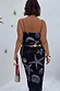 Black Seashell Mesh Cami Dress with white starfish prints, showing the back detail, thin straps and midi length.