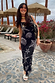 Thumbnail for Black Seashell Mesh Cami Dress with white starfish and shell prints, styled for a summer vacation.