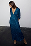 Teal Sequin Emma Dress featuring a V-neckline and long sleeves, styled with gold heels and a gold necklace.