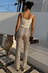 Silver Sequin Diva Trouser featuring all-over sequins and a flared leg, shown from the back in an outdoor setting.