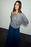Thumbnail for Gunmetal Sequin Tilly Top with an off-the-shoulder neckline, styled with dark blue wide-leg denim jeans.