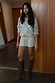 Silver Sequin Shorts and matching jacket co-ord styled with brown knee-high boots.