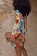 Shell Marley Shirt in a multi abstract shell print with metallic detailing and a leopard print clutch.