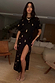Thumbnail for Black Shell Midi Leia Dress featuring a gold shell print, wrap tie skirt, and T-shirt style top.