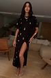 Black Shell Midi Leia Dress featuring a gold shell print, wrap tie skirt, and T-shirt style top.