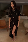 Black Shell Midi Leia Dress with a gold shell print, t-shirt bodice and wrap skirt with a high slit.