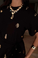 Thumbnail for Black Shell Midi Leia Dress featuring gold shell prints and chunky gold jewellery.